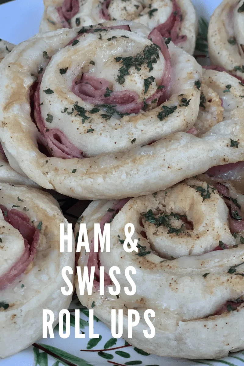 These Ham and Swiss Roll Ups are stuffed with cheese, ham, Dijion mustard and topped with flavorful garlic butter! These are perfect for lunch, dinner or even an appetizer! They are WW friendly! via @pounddropper