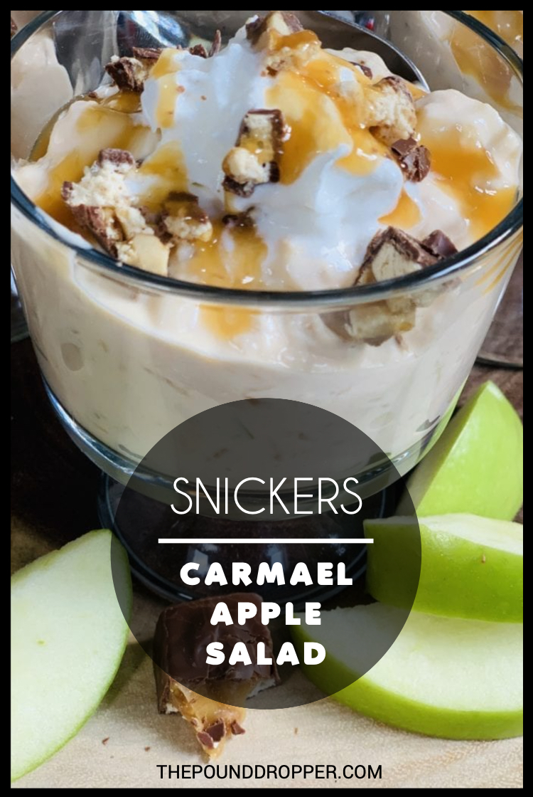 This Snickers Caramel Apple Salad is simple to make and packed with protein, diced apples, crushed pineapple, nonfat yogurt, and topped with pieces of snickers bar-Perfect for breakfast, a potluck, or even as a dessert. via @pounddropper