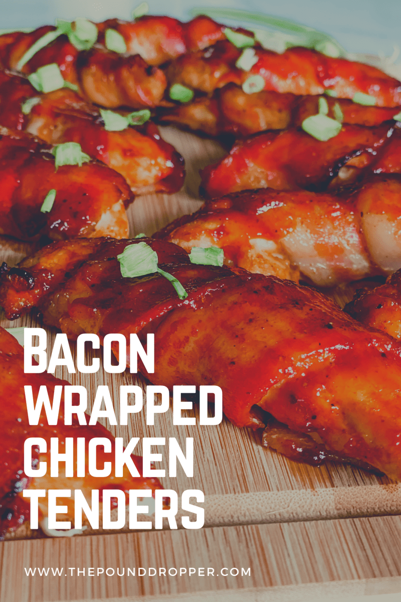 Bacon Wrapped Chicken Tenders are a family favorite! Seasoned skinless, boneless chicken tenders wrapped in center cut bacon, and smothered in sugar free BBQ sauce-making them lower in sugar and more healthier! via @pounddropper