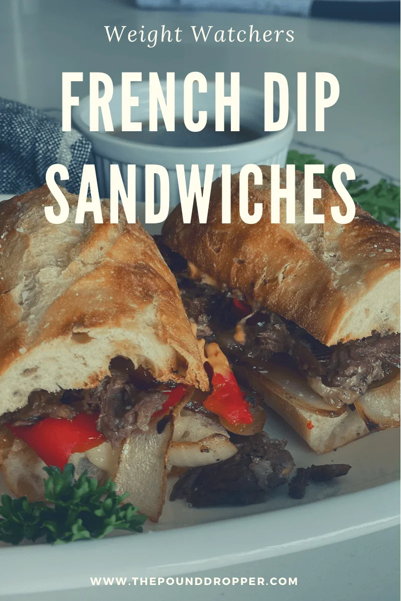 These Lightened Up French Dip Sandwiches will rock your world! The combination of the tender seasoned beef, caramelized onions, roasted red pepper, gooey provolone cheese, in a crusty baguette and served with a rich au jus makes these French Dip sandwiches insanely delicious! via @pounddropper