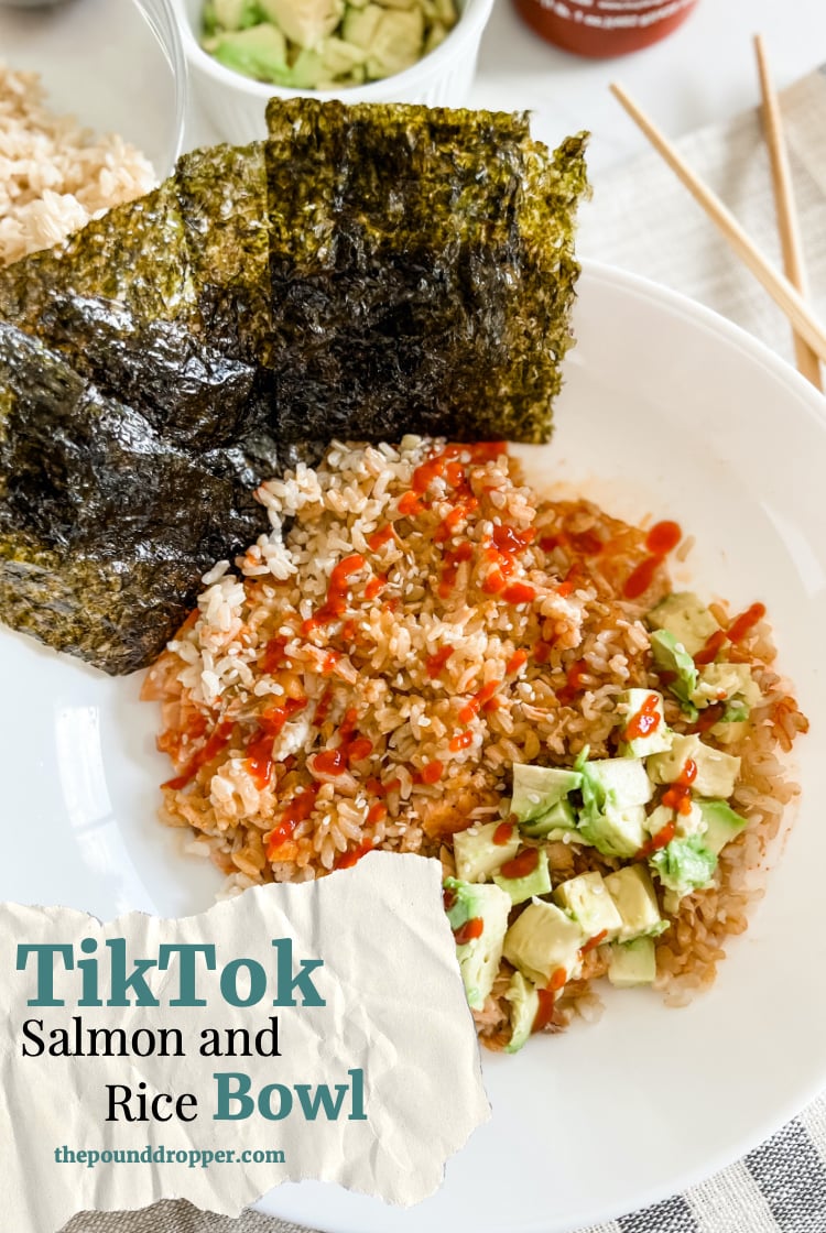 This Salmon and Rice Bowl is a TikTok viral sensation, it's so simple to make using leftover rice and salmon! Serve with Japanese mayo, soy sauce, diced avocado, and roasted seaweed sheets! via @pounddropper