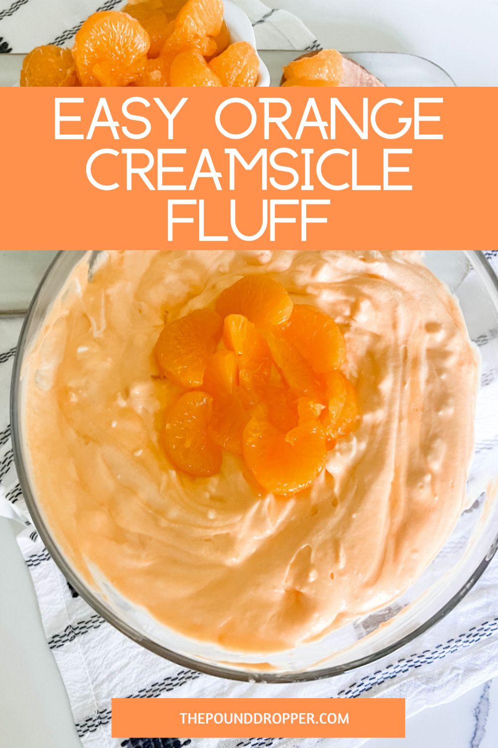 This Orange Creamsicle Fluff is an easy dessert salad that tastes like an orange creamsicle-this fluff makes for a fantastic side dish to any party, potluck, or BBQ!!  via @pounddropper