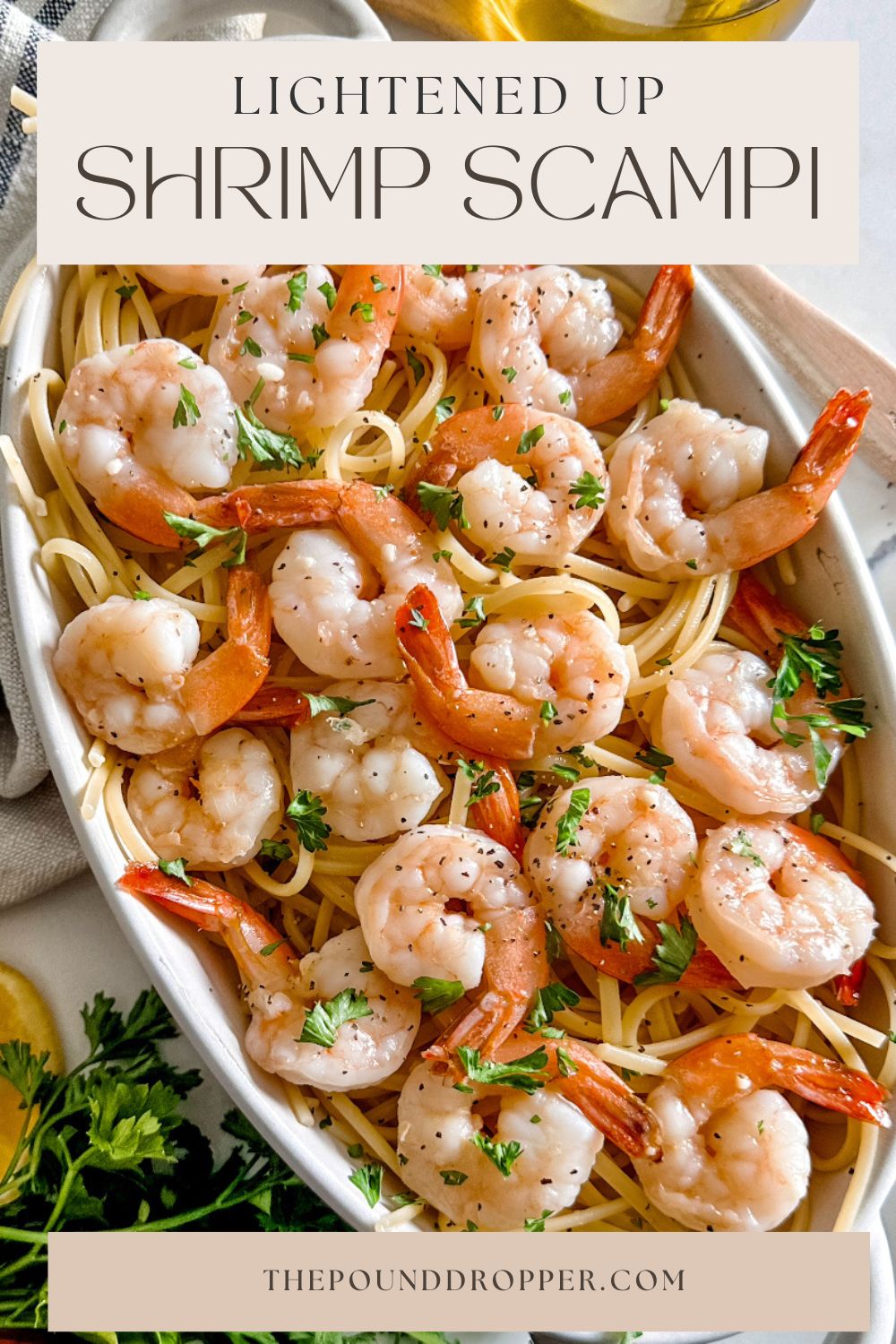 This Lightened Up Shrimp Scampi is a simple pasta dish packed with shrimp and simmered in a lip smacking garlic butter sauce and served over pasta. A restaurant worthy pasta dish that takes less than 30 minutes from start to finish to make! via @pounddropper