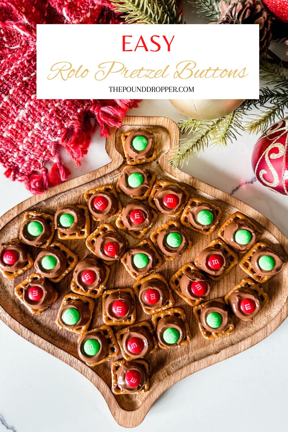 These Easy Rolo Pretzels Buttons are made with just 3 ingredients! The combination of sweet and salty treats are the perfect snack or treat!! An easy holiday treat to make this holiday season!  via @pounddropper