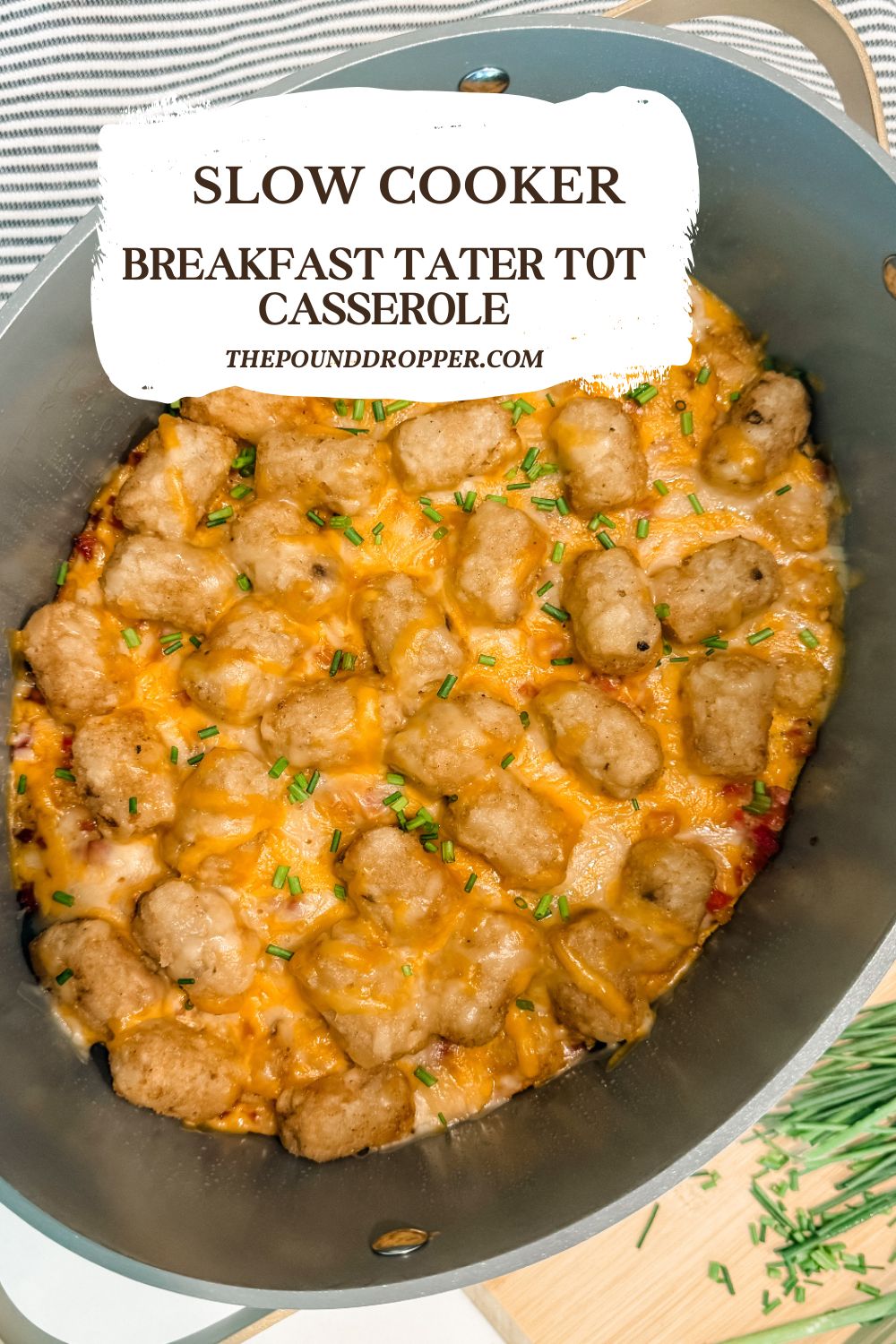 A Slow Cooker Breakfast Tater Tot Casserole is the perfect breakfast recipe to feed a crowd, or make for meal prep. It's cheesy, hearty, and easy to throw together! Perfect for the busy holiday season. via @pounddropper