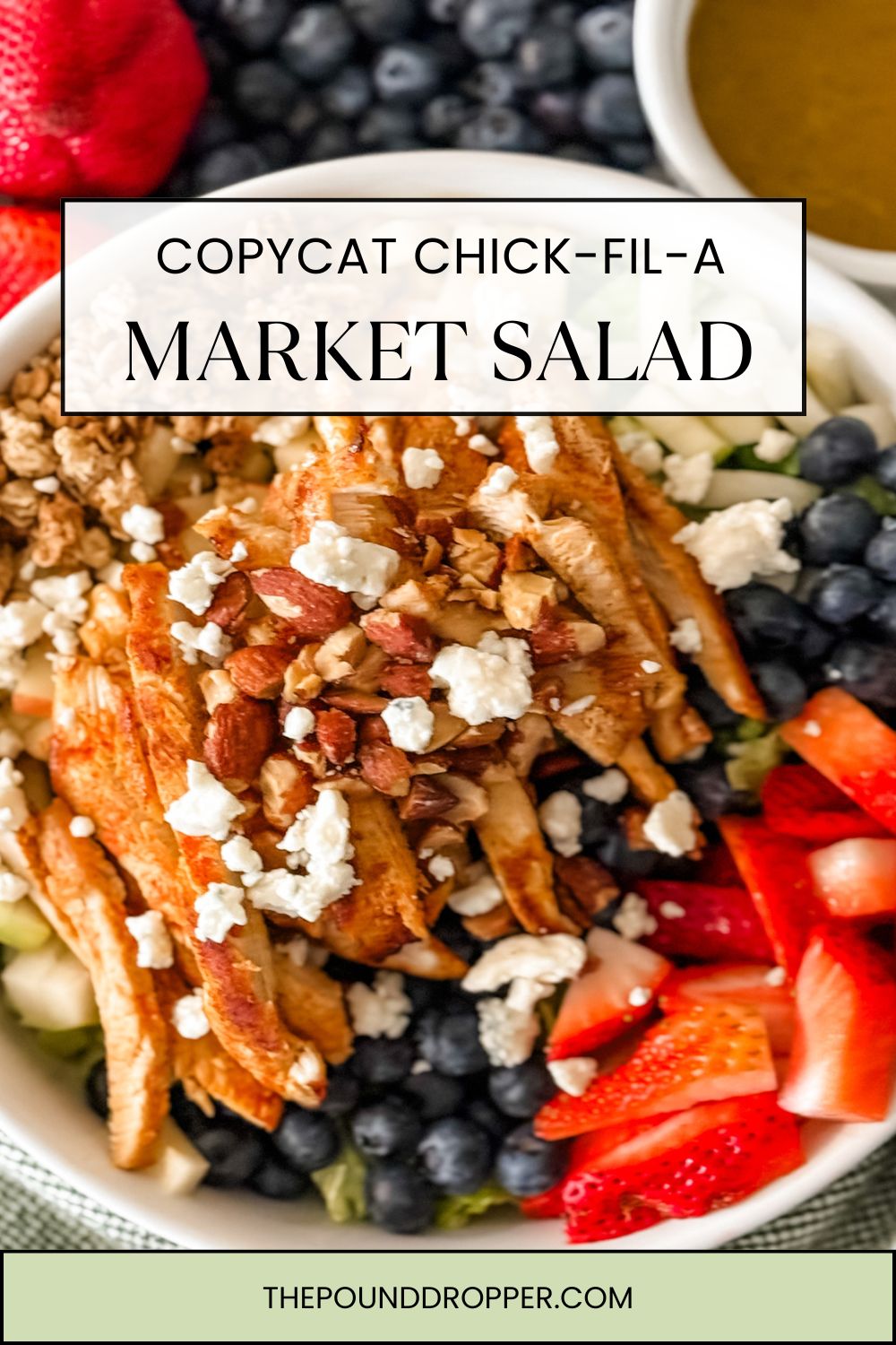 This Copycat Chick-fil-A market salad is filled with seasoned grilled chicken breast served on a fresh bed of mixed greens, topped with crumbled blue cheese and a mix of red and green apples, strawberries and blueberries. Topped with low point granola, roasted almonds and served with a zesty apple cider vinaigrette. via @pounddropper
