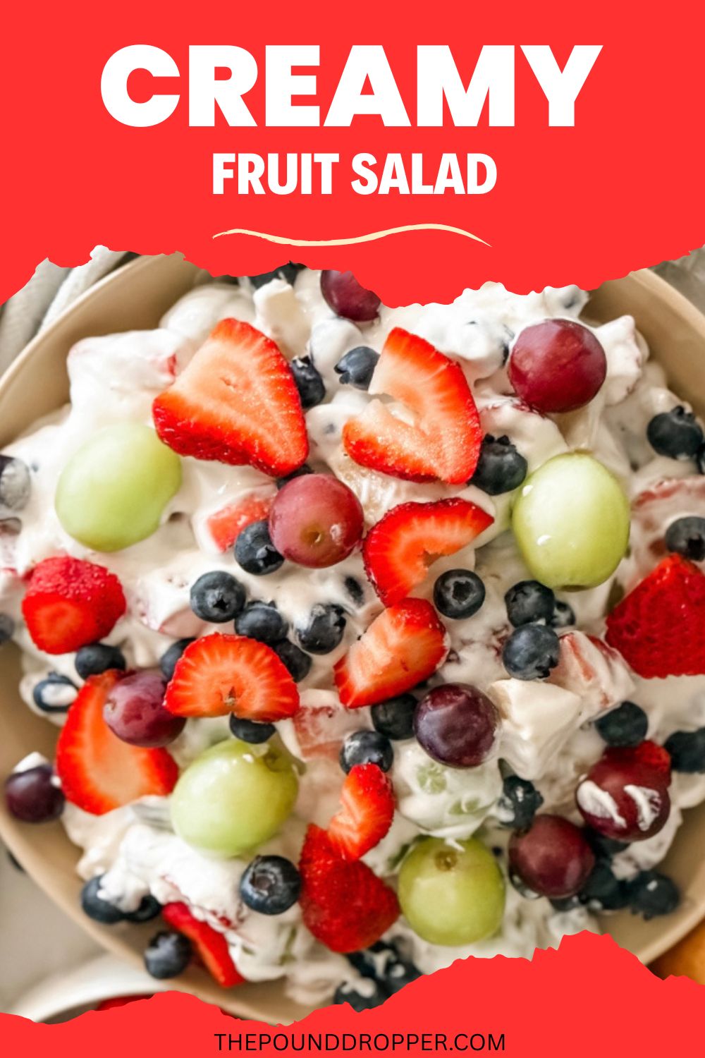 This Creamy Fruit Salad is simple combination of fresh fruit, non fat Greek yogurt, and sugar free cool whip! Serve it as a side salad or even as a dessert! This recipe is super versatile and comes together in less than 10 minutes! via @pounddropper